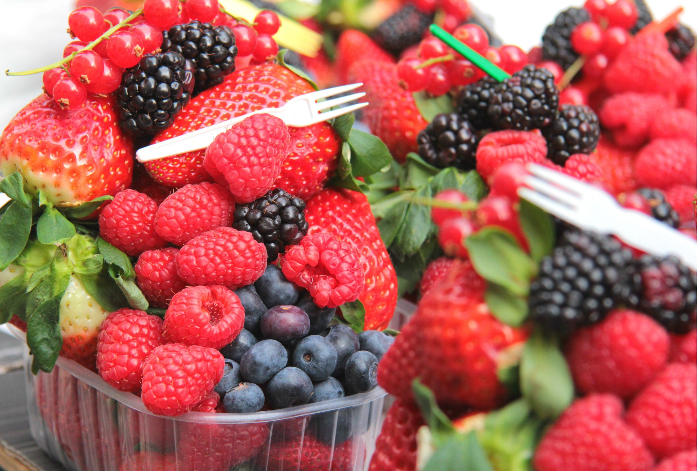 A vibrant assortment of fresh berries including strawberries, raspberries and blackberries - British Berries Guide