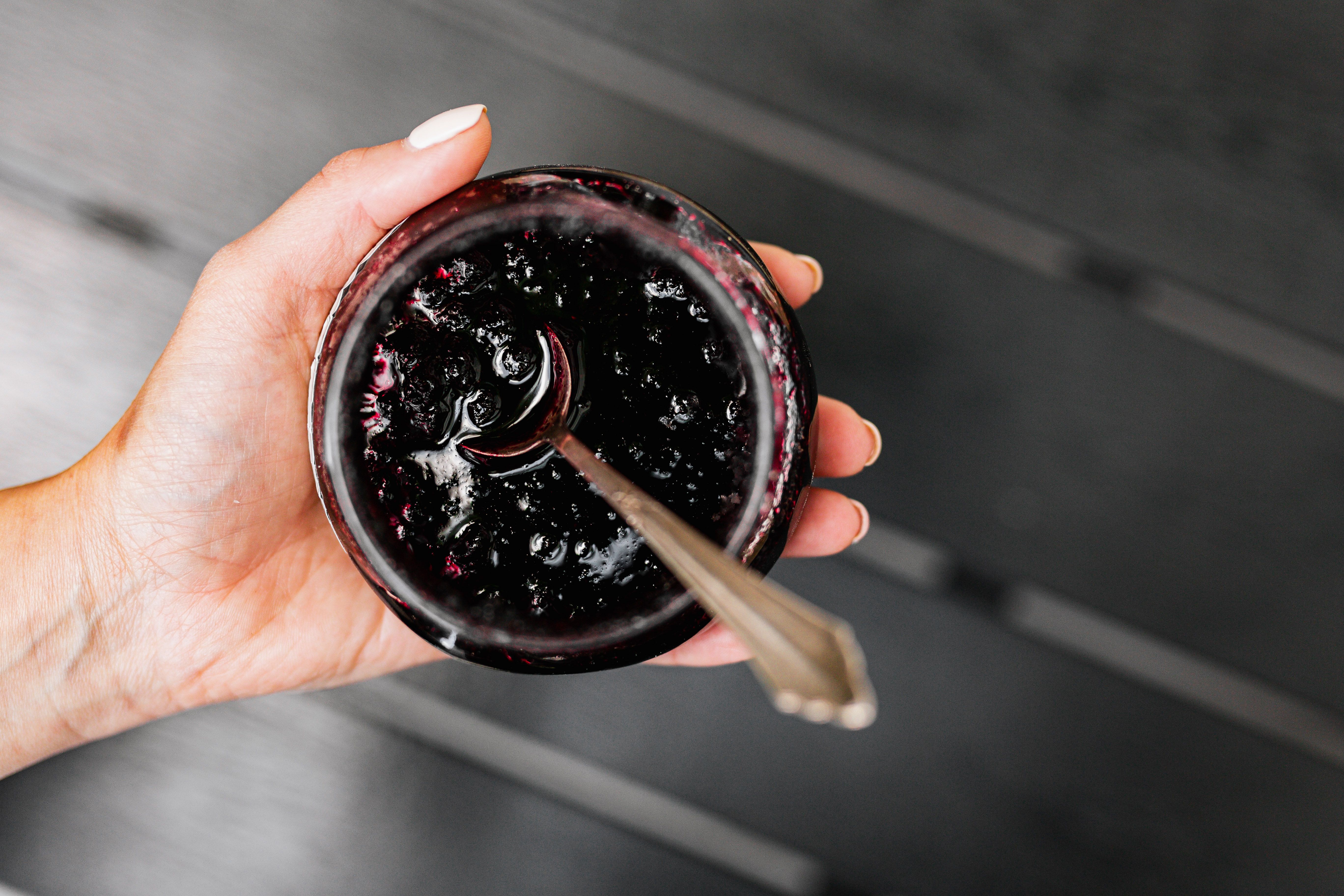 Jars of homemade dark purple bramble jelly