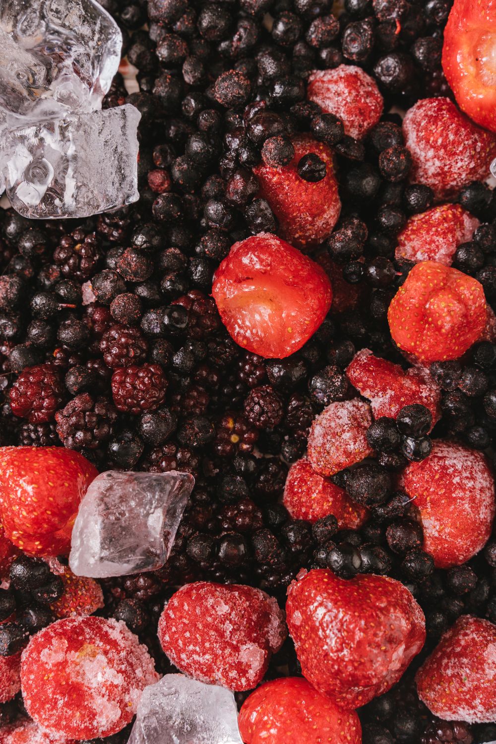 A mix of frozen berries with ice