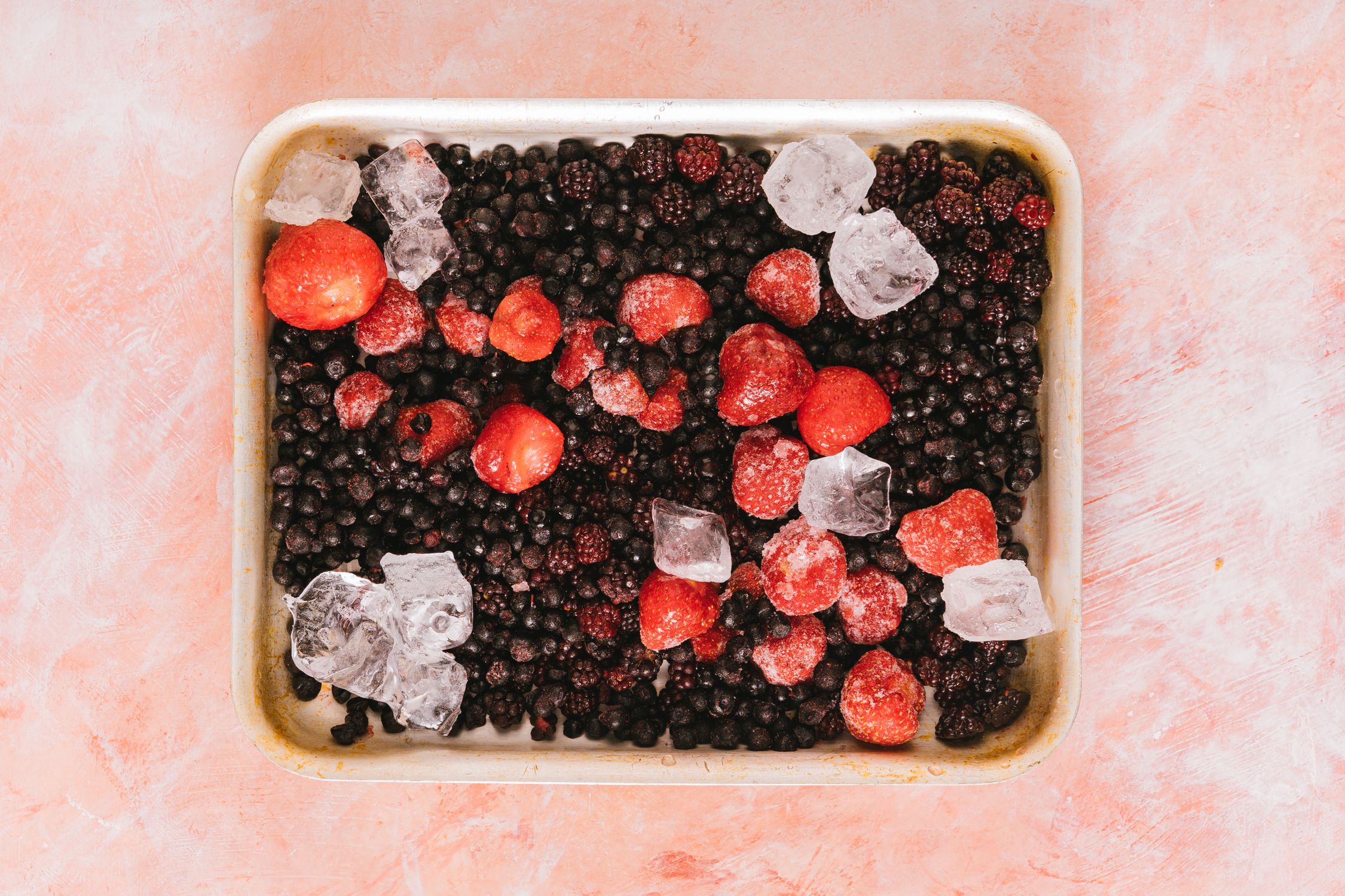 Mixed berries with ice on a tray ready for freezing - British Berries Guide